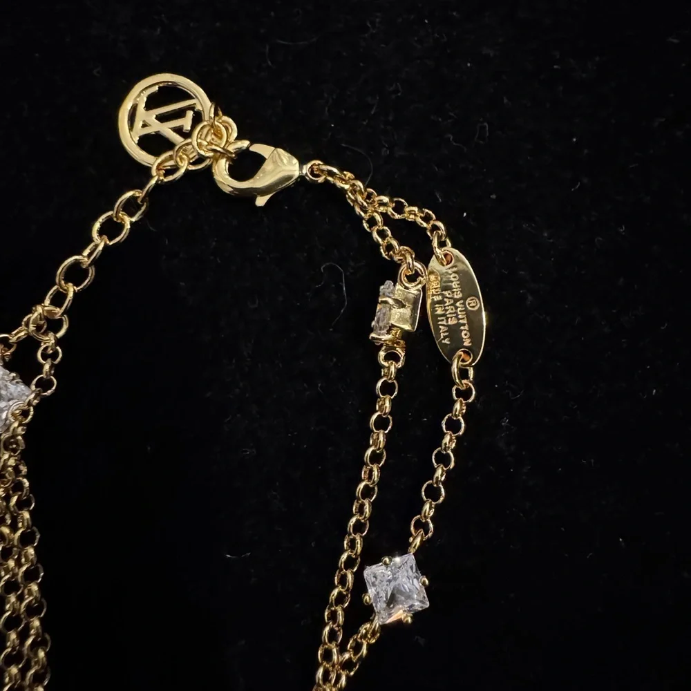 Louis Vuitton Gold and Silver Bracelet with Logo Charms - Picture 3 of 5
